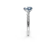 Cluster Engagement Ring Setting for Fancy Blue Heart-Shaped Center with Round Cut Accent Band and Prong Head in Platinum
