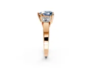 3 Stone Engagement Ring Setting for Fancy Blue Heart-Shaped Center with Matching Side Accents and Prong Head in Rose Gold