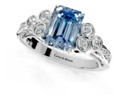 Cluster Engagement Ring Setting for Fancy Blue Emerald Cut Center with Bezel Accent Clusters and Prong Head in White Gold