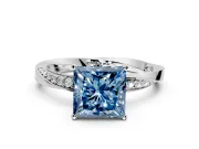 Side Accent Engagement Ring Setting for Fancy Blue Princess Cut Center with Accent Shoulders and Prong Head in Platinum