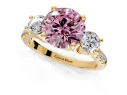 3 Stone Engagement Ring Setting for Fancy Pink Round Cut Center with Crossover Basket, Pave Band and Prong Head in Yellow Gold