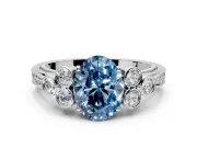 Cluster Engagement Ring Setting for Fancy Blue Oval Center with Bezel Accent Clusters and Prong Head in White Gold