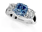 3 Stone Engagement Ring Setting for Fancy Blue Cushion Cut Center with Raised Basket Heads and Prong Head in Sterling Silver