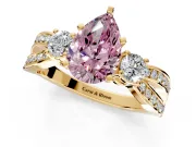 3 Stone Engagement Ring Setting for Fancy Pink Pear-Shaped Center with Pave Twist Band and Prong Head in Yellow Gold