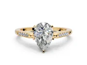 Solitaire Engagement Ring Setting for Pear-Shaped Center with Channel Accents and Prong Head in Yellow Gold