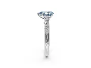 Cluster Engagement Ring Setting for Fancy Blue Pear-Shaped Center with Round Cut Accent Band and Prong Head in Platinum