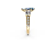 Channel-Set Engagement Ring Setting for Fancy Blue Marquise Center with Baguette Band and Prong Head in Yellow Gold