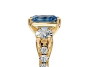 3 Stone Engagement Ring Setting for Fancy Blue Emerald Cut Center with Crossover Basket, Pave Band and Prong Head in Yellow Gold
