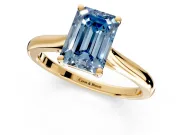 Solitaire Engagement Ring Setting for Fancy Blue Emerald Cut Center with Narrow Cathedral Band and Prong Head in Yellow Gold