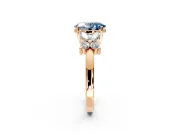 Floral Engagement Ring Setting for Fancy Blue Oval Center with Marquise Cluster Shoulders and Prong Head in Rose Gold