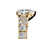Solitaire Engagement Ring Setting for Pear-Shaped Center with Pave Cathedral Shoulders and Prong Head in Yellow Gold