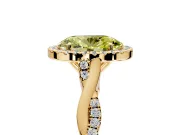 Halo Engagement Ring Setting for Fancy Yellow Oval Center with Twist Band and Prong Head in Yellow Gold