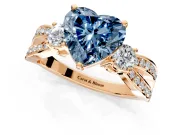 3 Stone Engagement Ring Setting for Fancy Blue Heart-Shaped Center with Pave Twist Band and Prong Head in Rose Gold