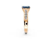 Solitaire Engagement Ring Setting for Fancy Blue Emerald Cut Center with Round Cut Channel Band and Prong Head in Rose Gold