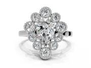 Cluster Halo Engagement Ring Setting for Pear-Shaped Center with Milgrain Bezel Accents and Prong Head in Sterling Silver