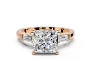 3 Stone Engagement Ring Setting for Princess Cut Center with Channel Baguette Accents and Prong Head in Rose Gold