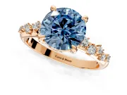 Solitaire Engagement Ring Setting for Fancy Blue Round Cut Center with Trailing Leaf Accent Band and Prong Head in Rose Gold
