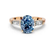 3 Stone Engagement Ring Setting for Fancy Blue Oval Center with Tapered Baguettes, Plain Band and Prong Head in Rose Gold