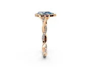 Halo Engagement Ring Setting for Fancy Blue Pear-Shaped Center with Twist Band and Prong Head in Rose Gold