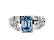 Floral Engagement Ring Setting for Fancy Blue Emerald Cut Center with Trailing Marquise Accents and Prong Head in Platinum