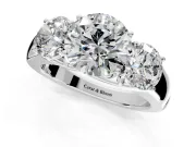 3 Stone Engagement Ring Setting for Round Cut Center with Raised Basket Heads and Prong Head in Platinum