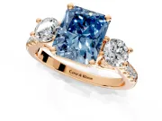 3 Stone Engagement Ring Setting for Fancy Blue Radiant Cut Center with Crossover Basket, Pave Band and Prong Head in Rose Gold