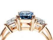 3 Stone Engagement Ring Setting for Fancy Blue Emerald Cut Center with Matching Side Accents and Prong Head in Rose Gold