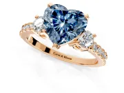 3 Stone Engagement Ring Setting for Fancy Blue Heart-Shaped Center with Round Cut Side Accents and Prong Head in Rose Gold