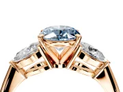 3 Stone Engagement Ring Setting for Fancy Blue Oval Center with Large Pear-Shaped Accents and Prong Head in Rose Gold