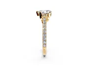 Solitaire Engagement Ring Setting for Pear-Shaped Center with Widening Pave Band and Claw Prong Head in Yellow Gold