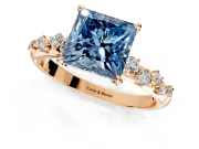Cluster Engagement Ring Setting for Fancy Blue Princess Cut Center with Round Cut Accent Band and Prong Head in Rose Gold