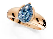 Tension Engagement Ring Setting for Fancy Blue Pear-Shaped Center with Wide Flat Band and Tension Head in Rose Gold