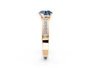 Solitaire Engagement Ring Setting for Fancy Blue Round Cut Center with Princess Cut Channel Band and Prong Head in Rose Gold
