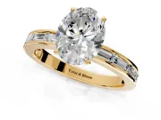 Solitaire Engagement Ring Setting for Oval Center with Channel Baguette Band and Prong Head in Yellow Gold