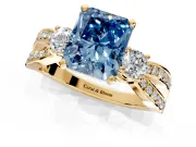 3 Stone Engagement Ring Setting for Fancy Blue Radiant Cut Center with Pave Twist Band and Prong Head in Yellow Gold