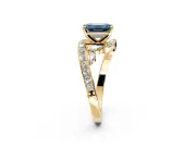 Solitaire Engagement Ring Setting for Fancy Blue Emerald Cut Center with Pave Bypass Twist Band and Prong Head in Yellow Gold