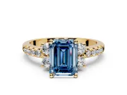 Paired Accent Engagement Ring Setting for Fancy Blue Emerald Cut Center with Pave Band and Prong Head in Yellow Gold