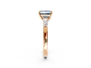 3 Stone Engagement Ring Setting for Fancy Blue Princess Cut Center with Tapered Baguettes, Plain Band and Prong Head in Rose Gold