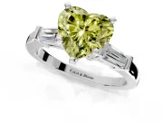 3 Stone Engagement Ring Setting for Fancy Yellow Heart-Shaped Center with Channel Baguette Accents and Prong Head in White Gold