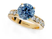 Solitaire Engagement Ring Setting for Fancy Blue Round Cut Center with Channel-Set Accents and Prong Head in Yellow Gold