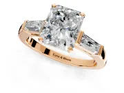 3 Stone Engagement Ring Setting for Radiant Cut Center with Tapered Baguettes, Plain Band and Prong Head in Rose Gold