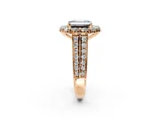 Large Accent Halo Engagement Ring Setting for Fancy Blue Emerald Cut Center with Pave Split Shank and Prong Head in Rose Gold