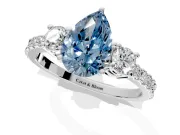 3 Stone Engagement Ring Setting for Fancy Blue Pear-Shaped Center with Round Cut Side Accents and Prong Head in Sterling Silver