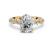 Solitaire Engagement Ring Setting for Oval Center with Trailing Leaf Accent Band and Prong Head in Yellow Gold