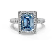 Halo Engagement Ring Setting for Fancy Blue Emerald Cut Center with Metal-Rimmed Halo, Pave Band and Prong Head in Platinum