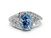 Halo Engagement Ring Setting for Fancy Blue Oval Center with Marquise and Pave Bypass Band and Prong Head in White Gold