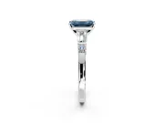Bar-Set Engagement Ring Setting for Fancy Blue Emerald Cut Center with Tapered Baguette Accents and Prong Head in White Gold