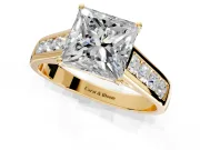 Solitaire Engagement Ring Setting for Princess Cut Center with Cathedral Channel Band and Prong Head in Yellow Gold