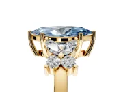 Floral Engagement Ring Setting for Fancy Blue Marquise Center with Marquise Cluster Shoulders and Prong Head in Yellow Gold