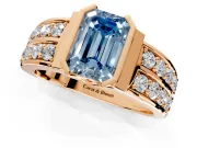 Bezel Engagement Ring Setting for Fancy Blue Emerald Cut Center with Wide Channel-Set Band and Bezel Head in Rose Gold